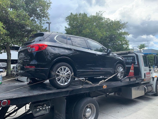 black buick envision on tow truck