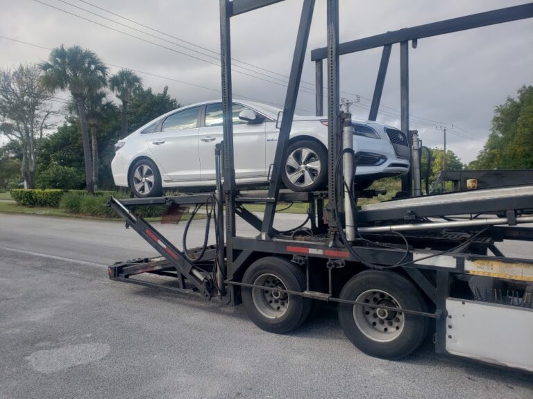 hyundai sonata sedan on open trailer