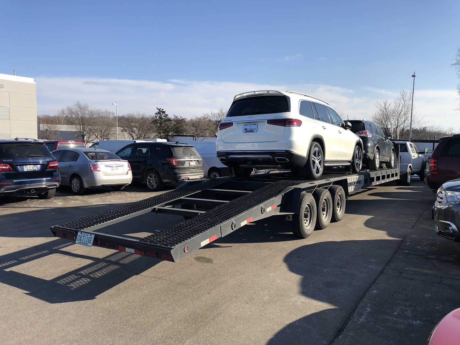 white mercedes benz on open trailer