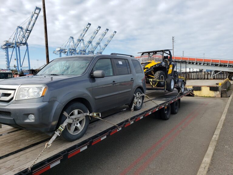 honda and 4x4 on trailer on a flatbed trailer