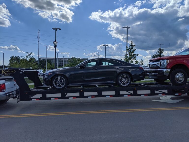 mercedes in open trailer