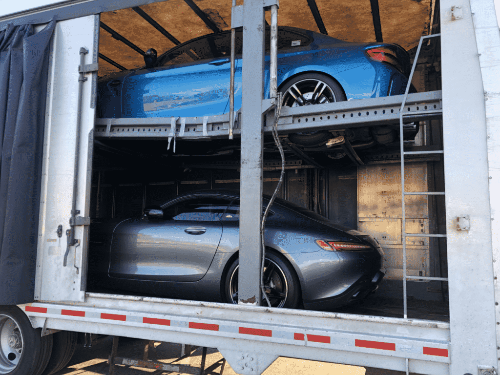 mercedes and bmw on enclosed trailer