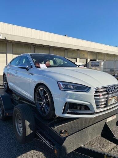 white audi on trailer