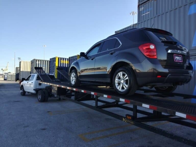 chevy suv on open trailer