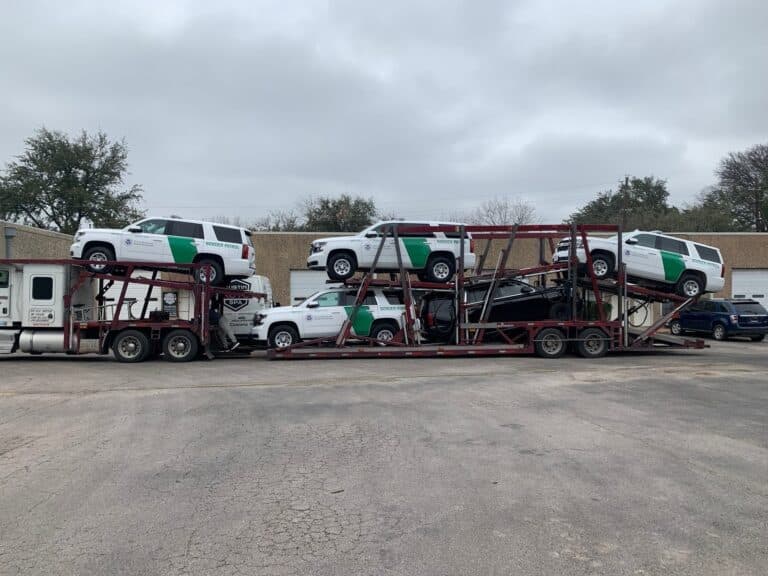 Montana Car Transport, bulk border patrol being transported on open trailer in Montana