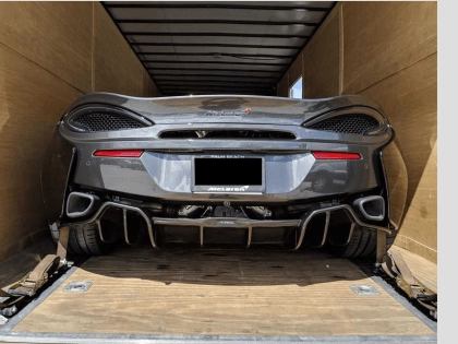 Florida car transport service — open carrier loading vehicles for statewide and nationwide shipping