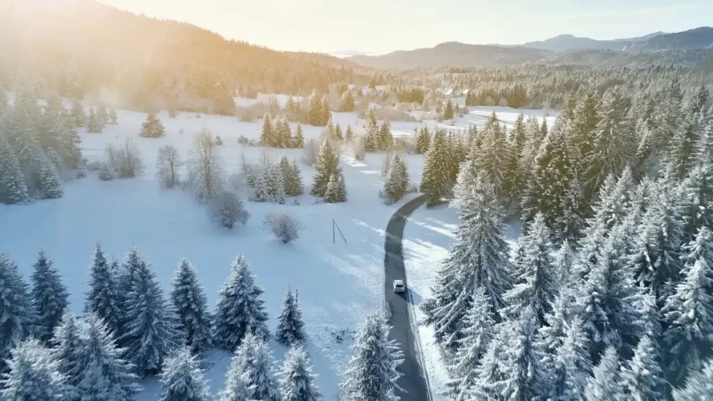 Driving through the snowy mountains
