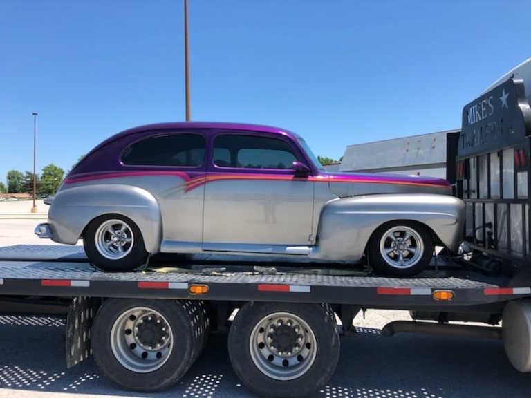 two tone classic car on trailer for auto transport