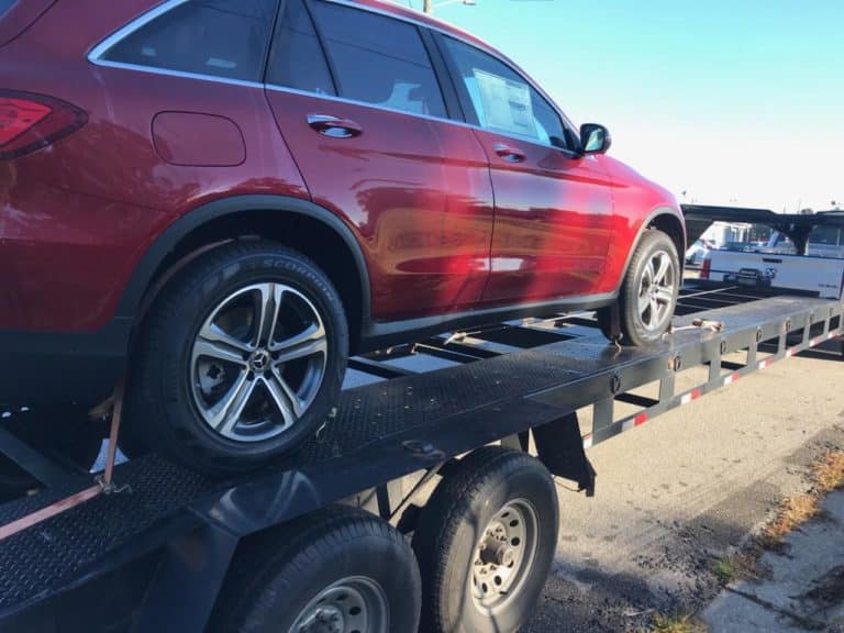 red car loaded for transportation