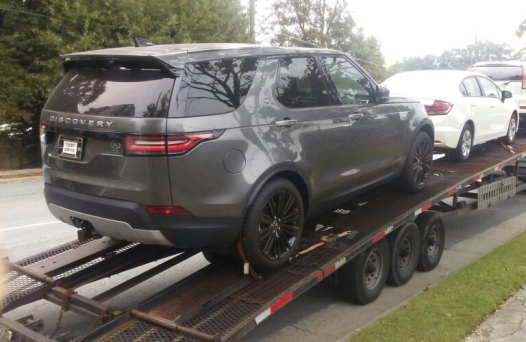 land rover on open trailer