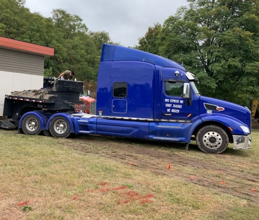 Commercial truck positioned for business vehicle driveaway planning