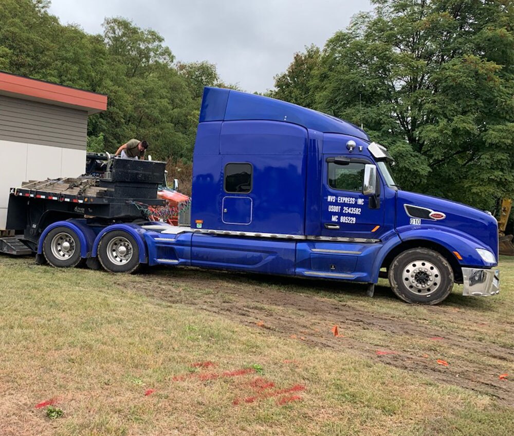 Commercial truck positioned for business vehicle driveaway planning