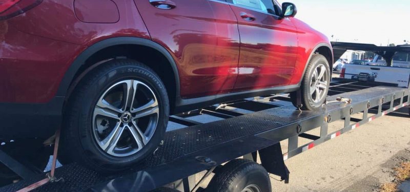 red car loaded for transportation