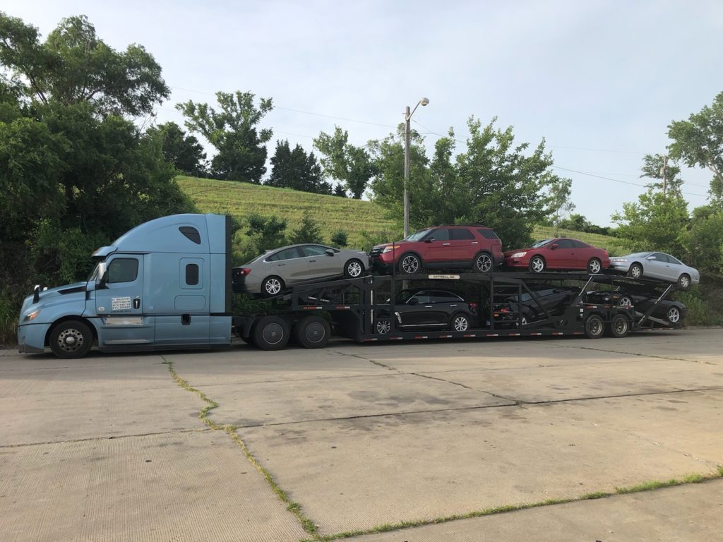 multiple vehicles on bulk auto trailer for auto transport
