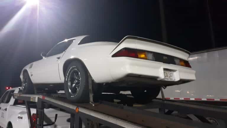 pontiac on open trailer