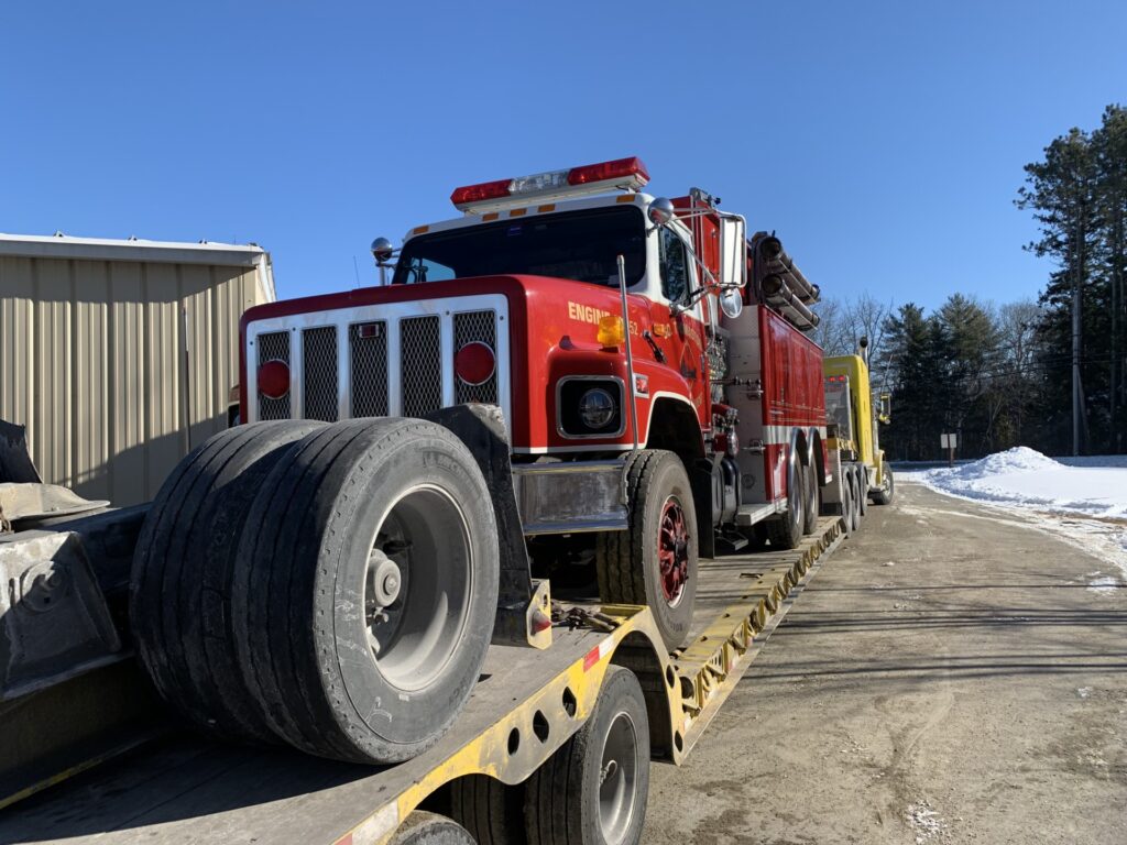 Transporting a classic pumper truck.