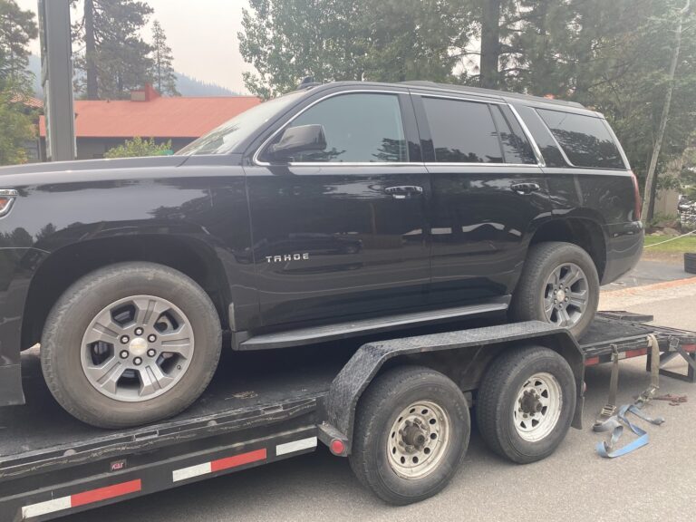black chevy tahoe on trailer
