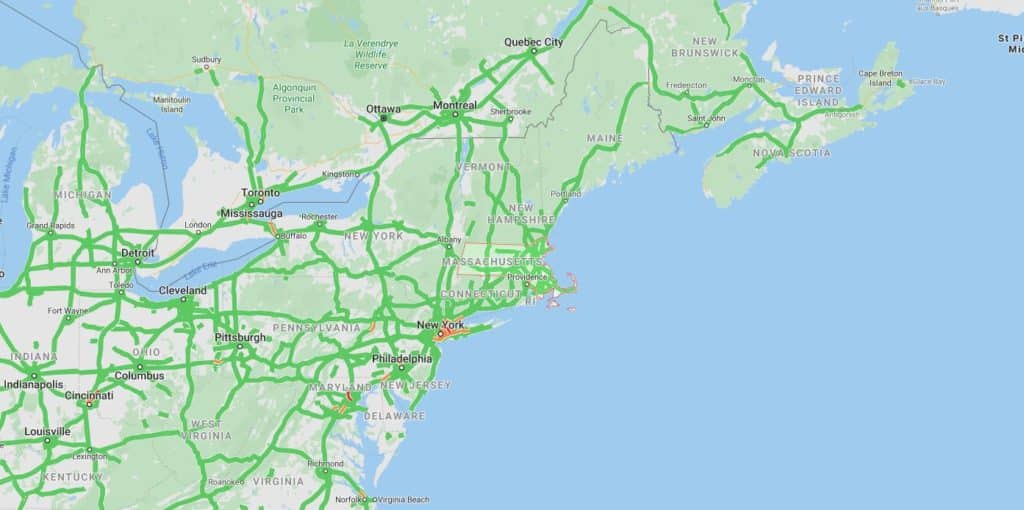 Traffic map of the Northeastern United States, with interstates and urban areas in green and red indicating congestion around New York City.