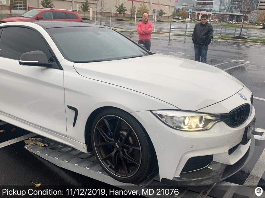 white BMW loaded for transport