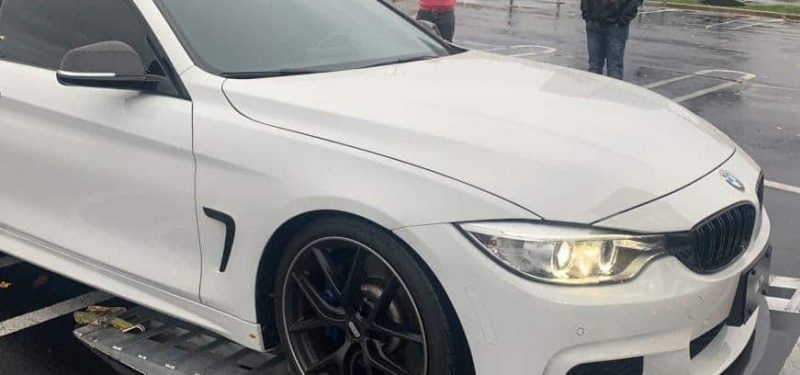 white BMW loaded for transport