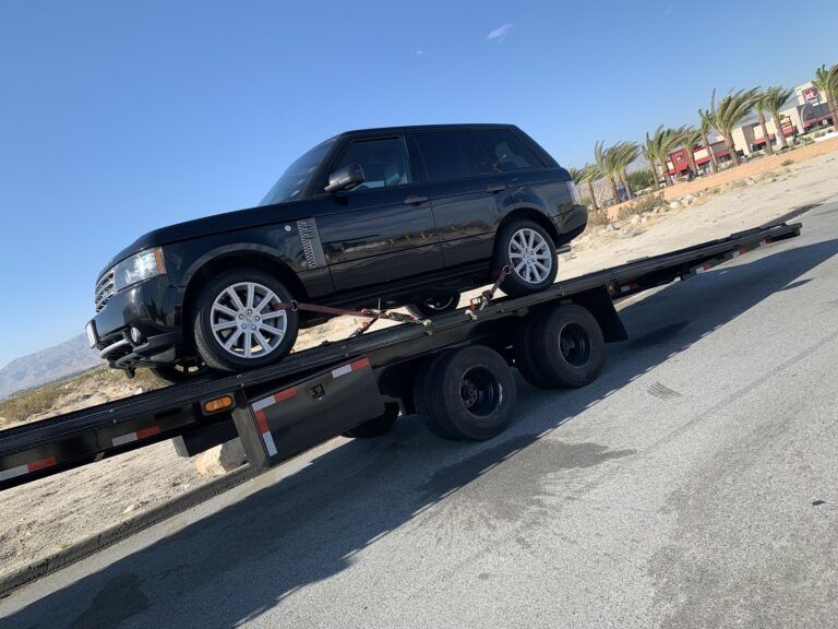 range rover on open trailer