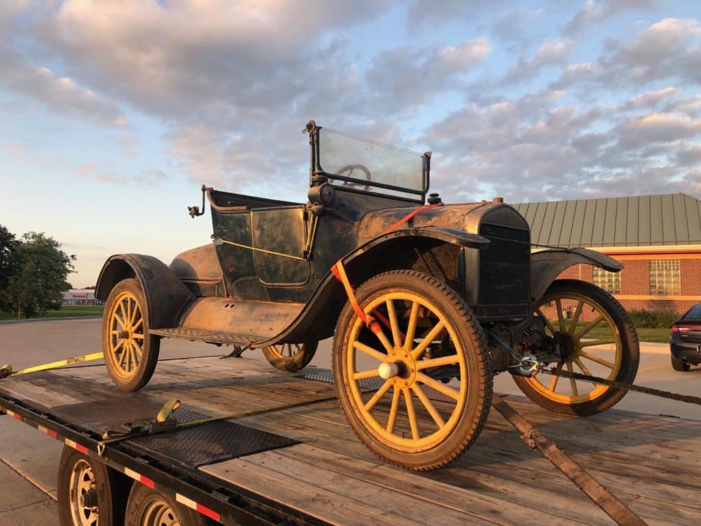 vintage vehicle used in movie set for auto transport