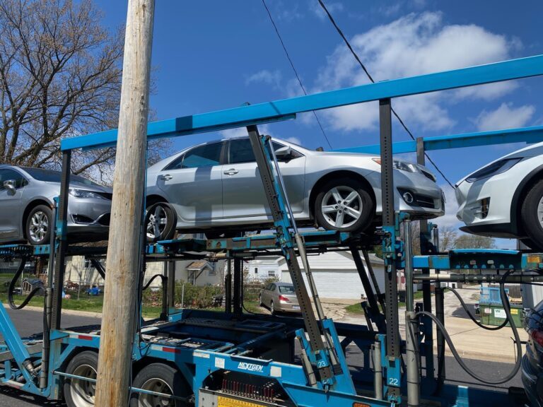toyota camry on open trailer