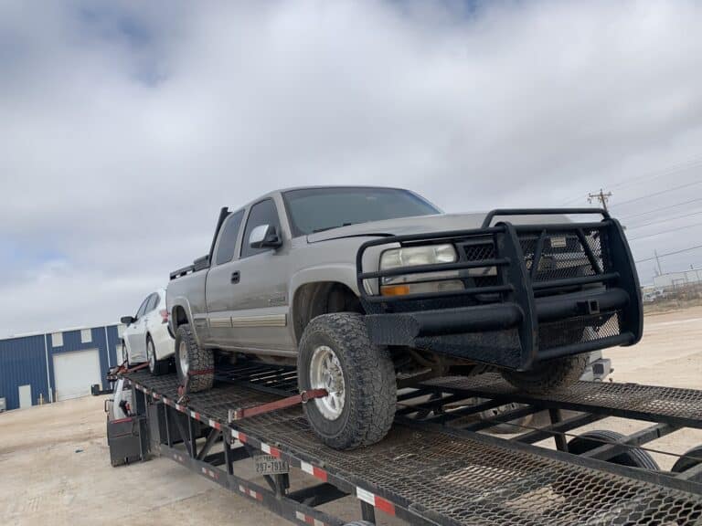 chevy truck on open trailer