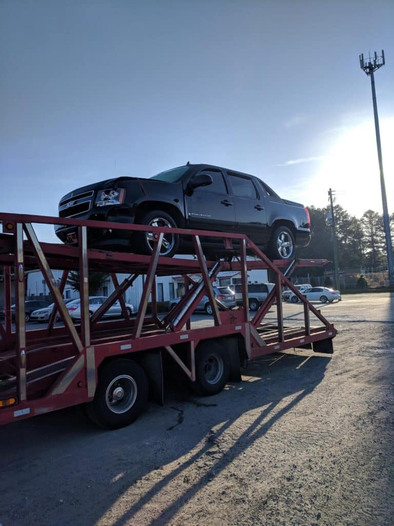 chevy avalanche on open trailer