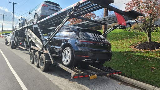 porsche macan on open trailer