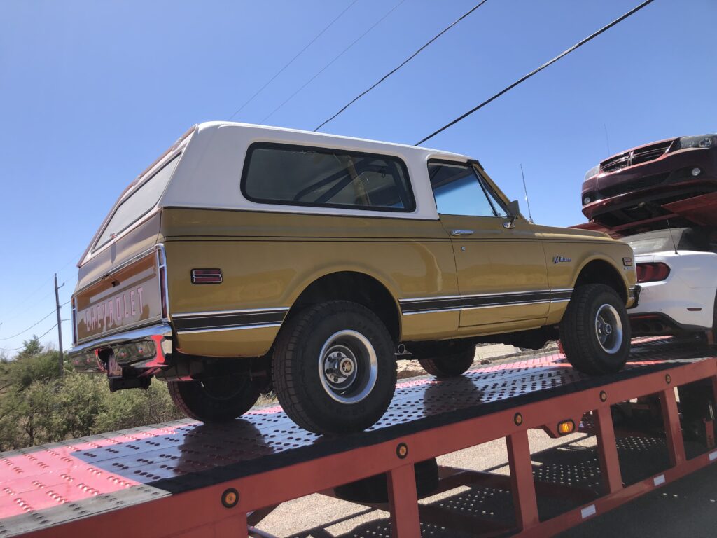 Chevy blazer on open trailer