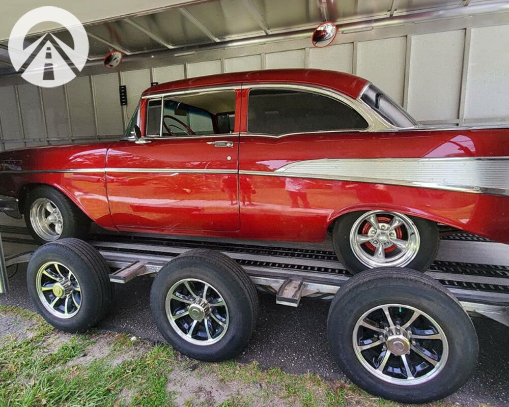 Top Rated Nationwide Car Shipping Company shipping a red and white 1956 Chevrolet
