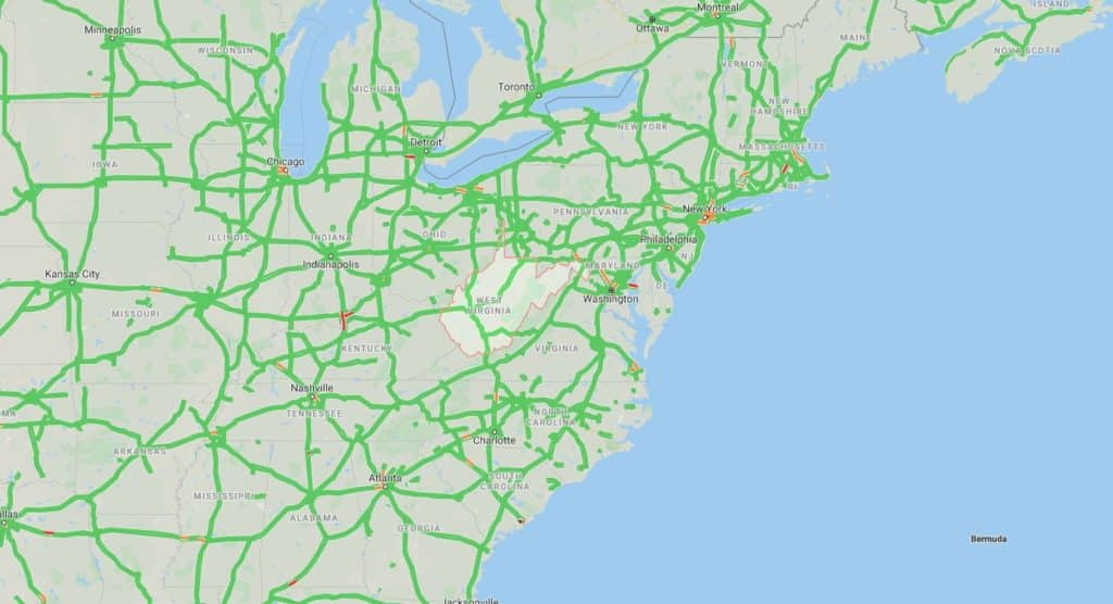 Traffic congestion map of the eastern United States and part of Canada, with green lines for free-flowing traffic and red lines for heavy congestion.