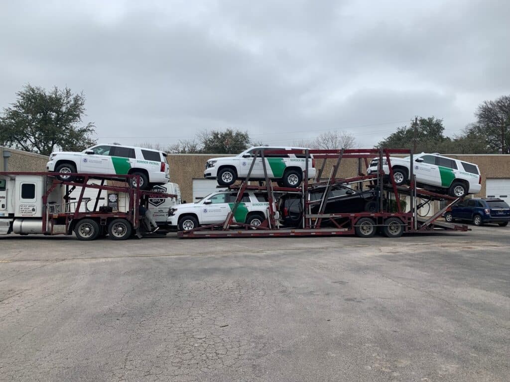 Montana Car Transport, bulk border patrol being transported on open trailer in Montana