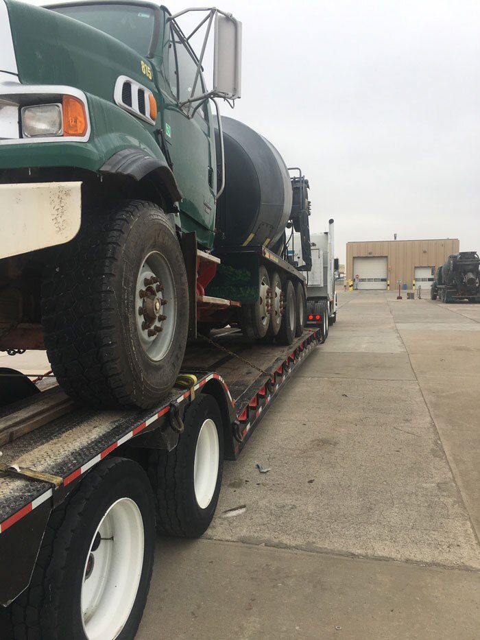 Alaska Truck Driveaway, moving a green water tank truck in Anchorage, AL