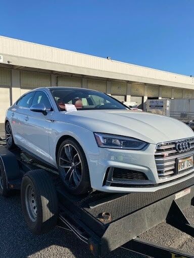 white audi on trailer
