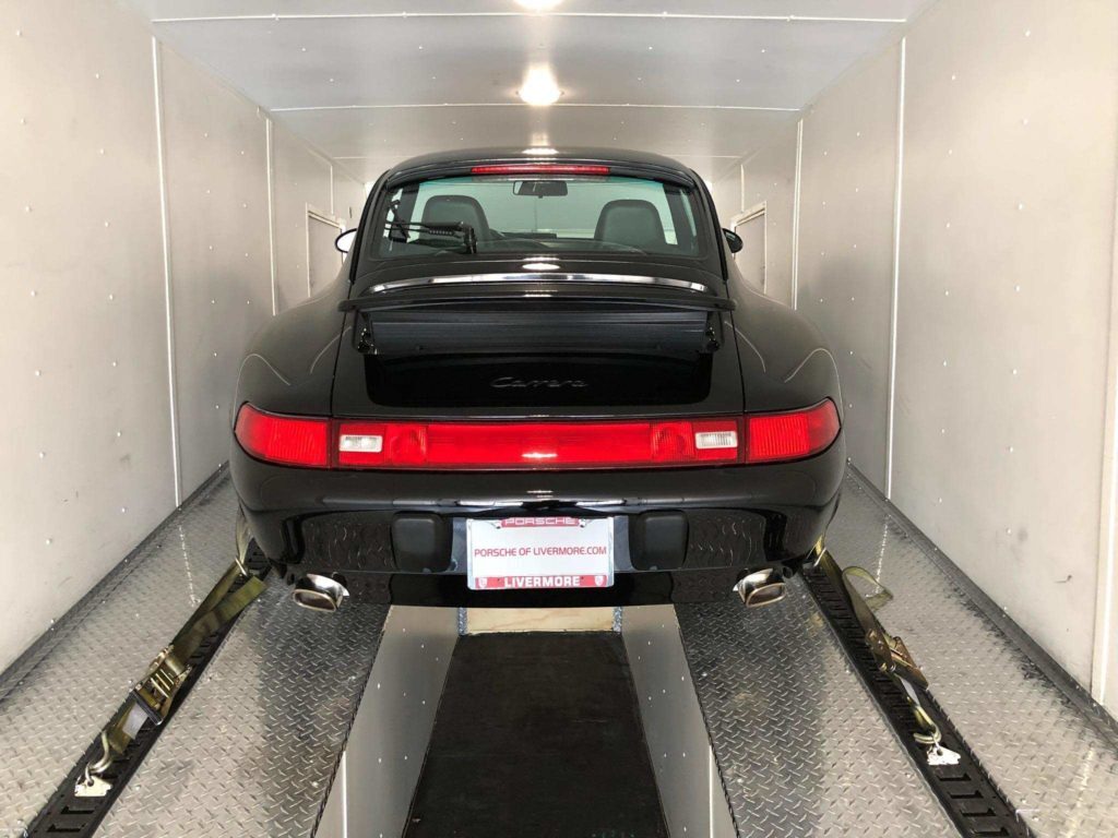 classic porsche on a closed trailer