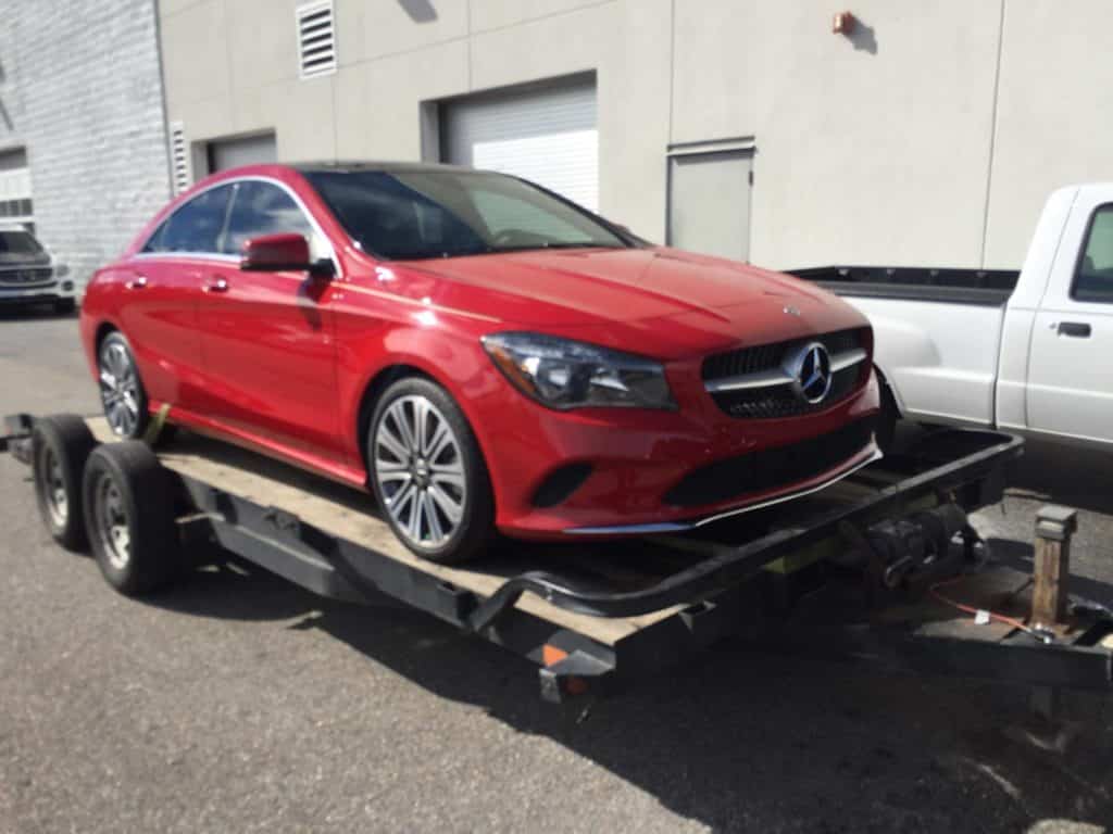 red mercedes c-class on autotransport.com's trailer