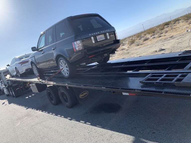 range rover on open trailer