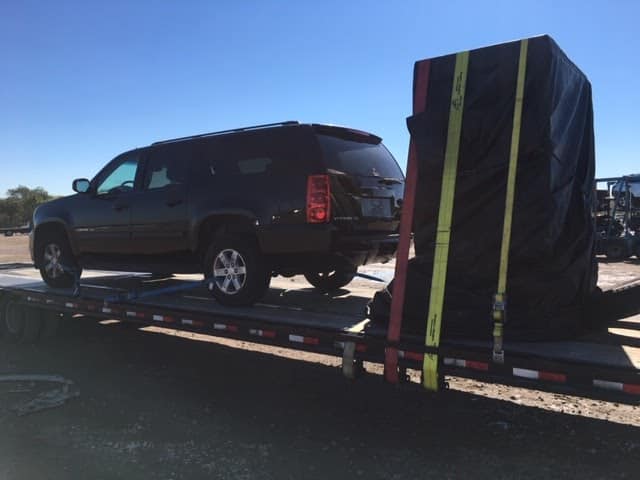 black gmc yukon on trailer