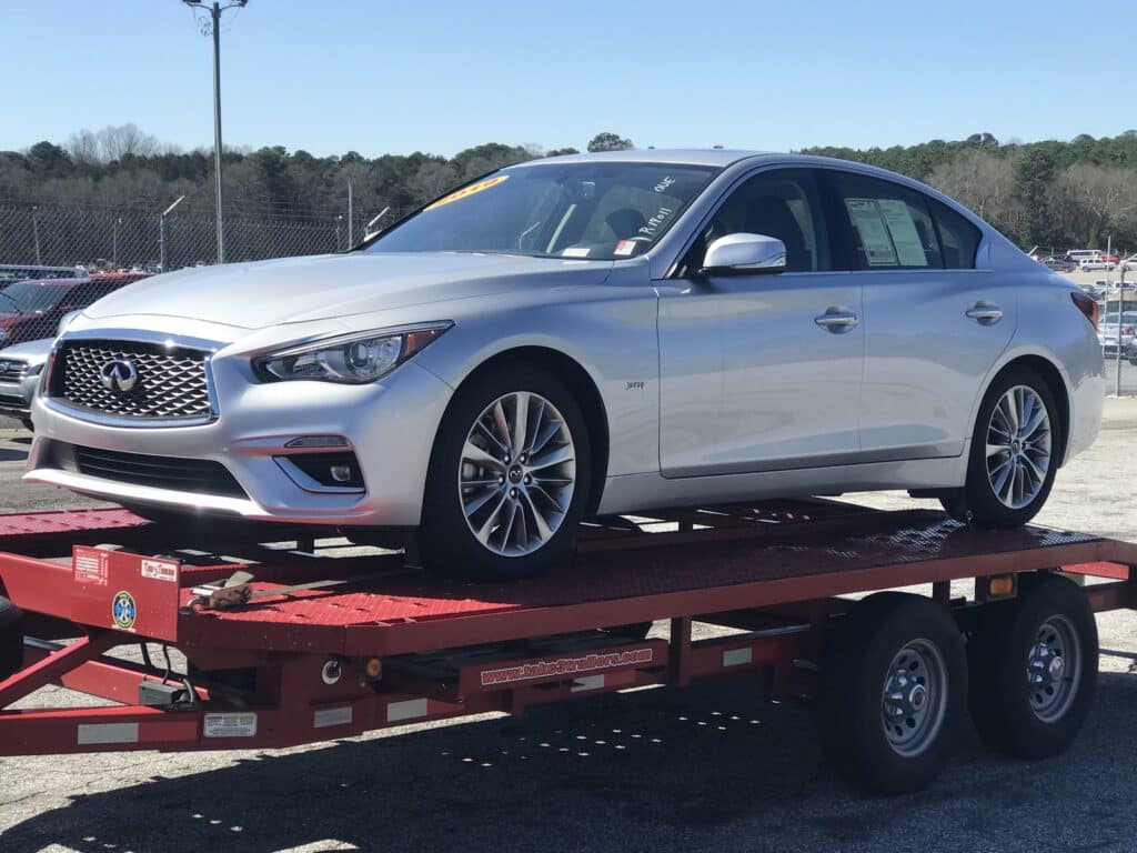 silver infiniti Q50 on trailer