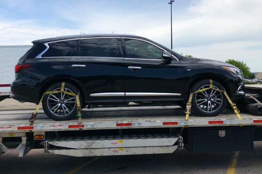 black car on a truck