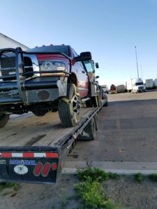 towing truck on autotransport.com's trailer for transport