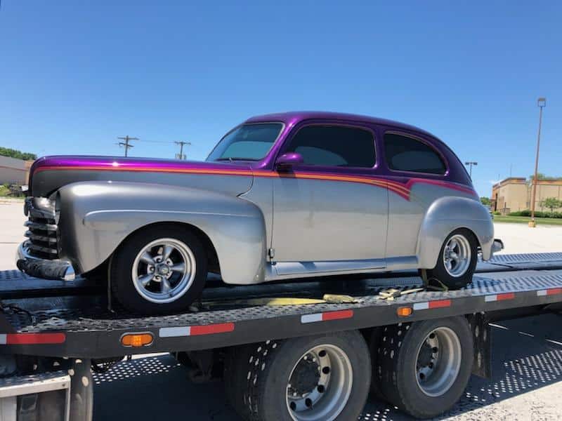 purple & silver car on RNG Trailer for auto transport
