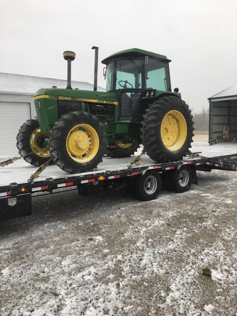 tractor being transported during the better season for transport