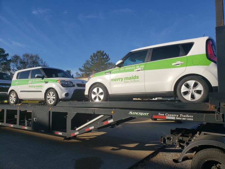 double commercial autos on trailer for auto transport