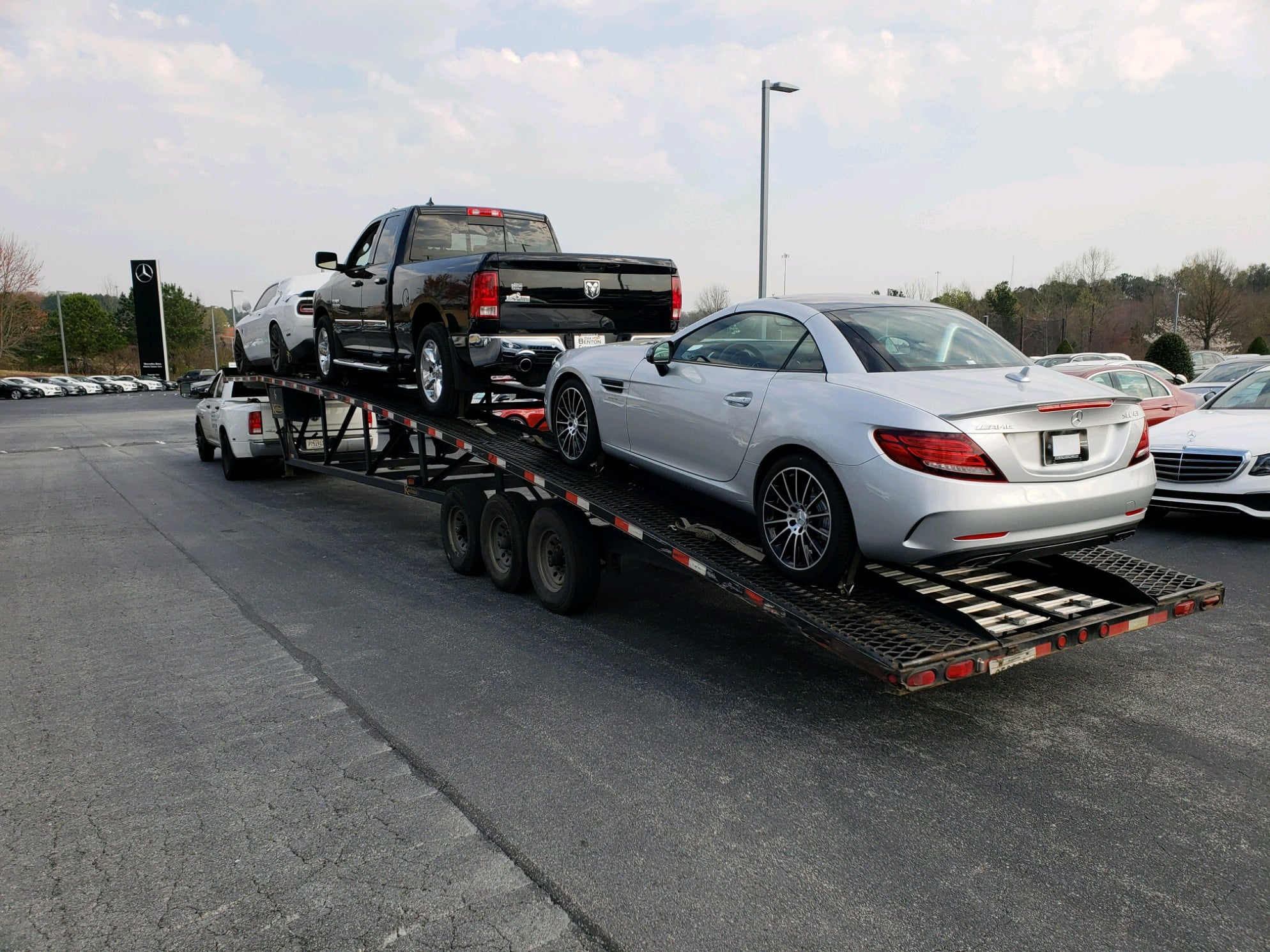 silver mercedes on trailer for auto transport