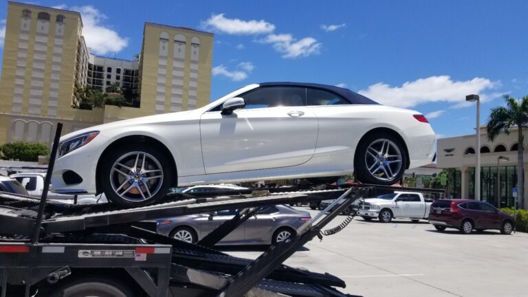 side shot of white mercedes ready for auto transport