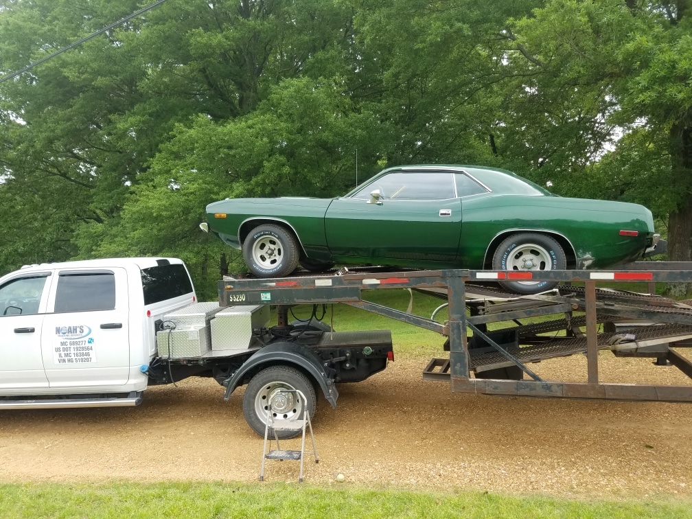 forest green muslce car on stepdeck trailer for auto transport to las vegas