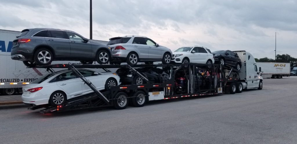 multiple vehicles on long haul trailer for autotransport